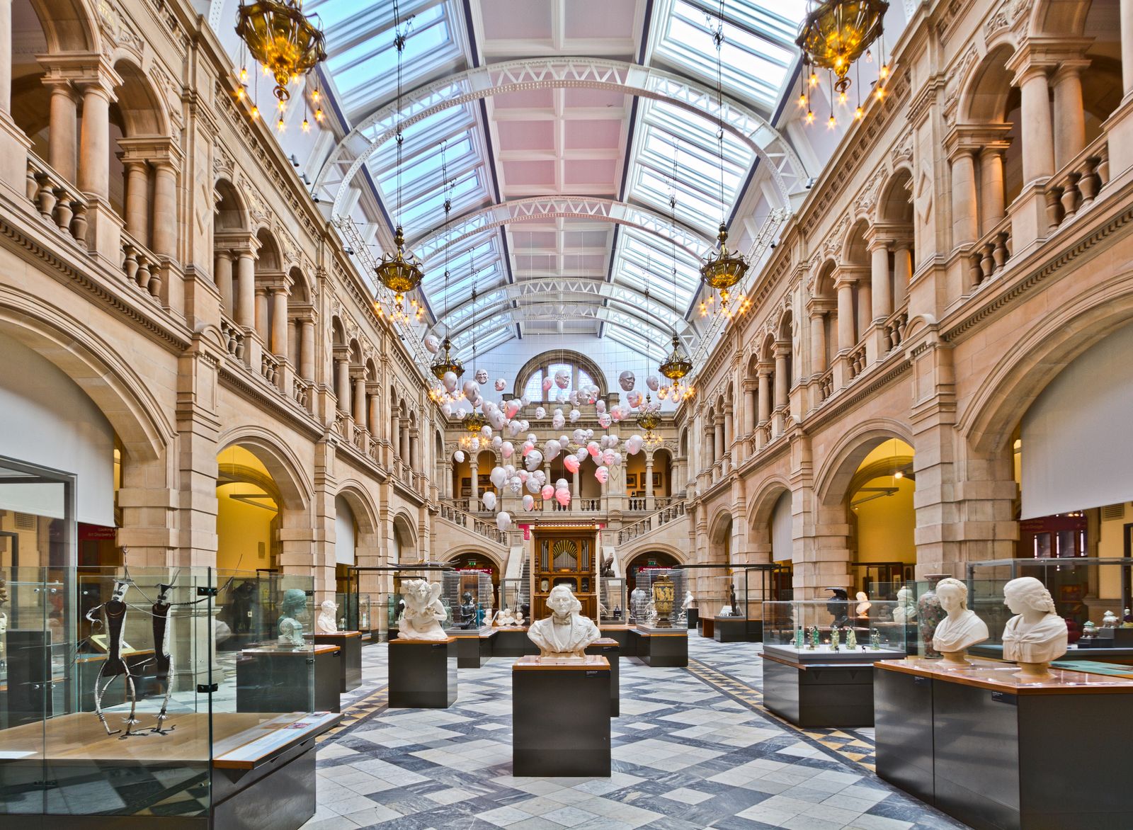 Interior view of an art museum gallery with visitors.