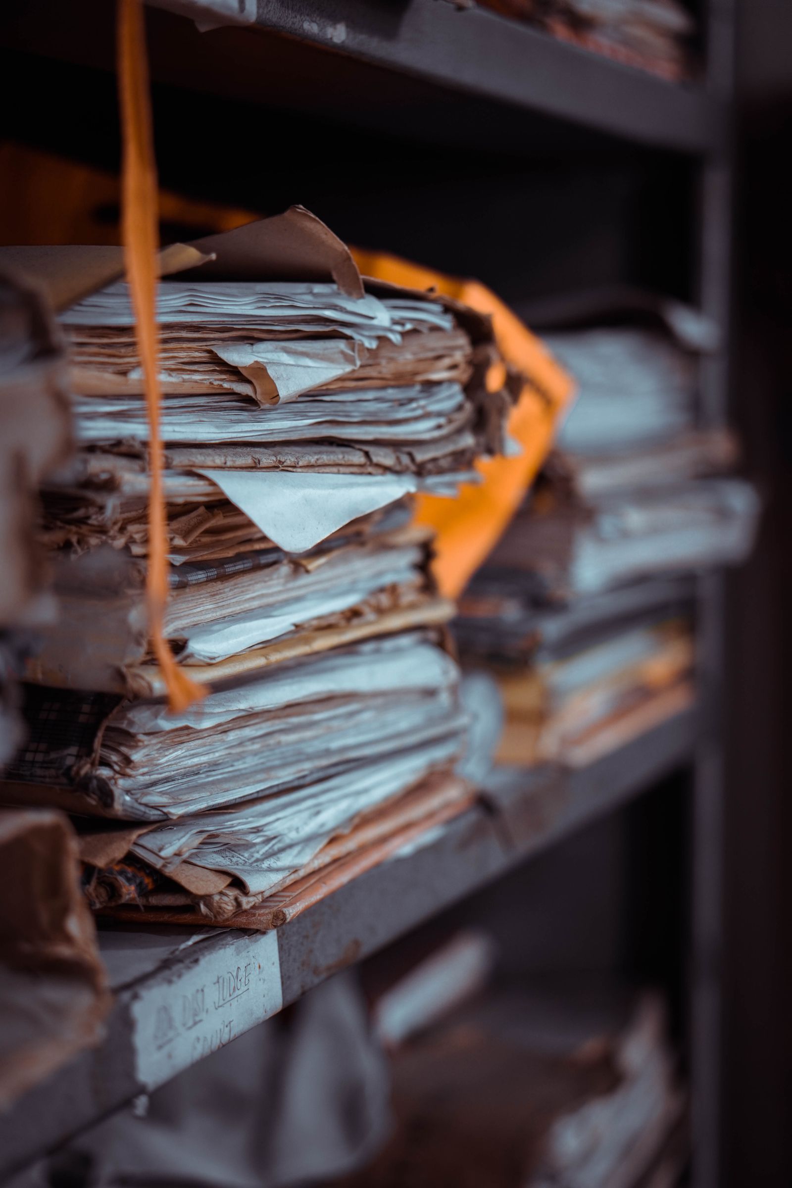 Assessment documents and printed report on a wooden meeting table.