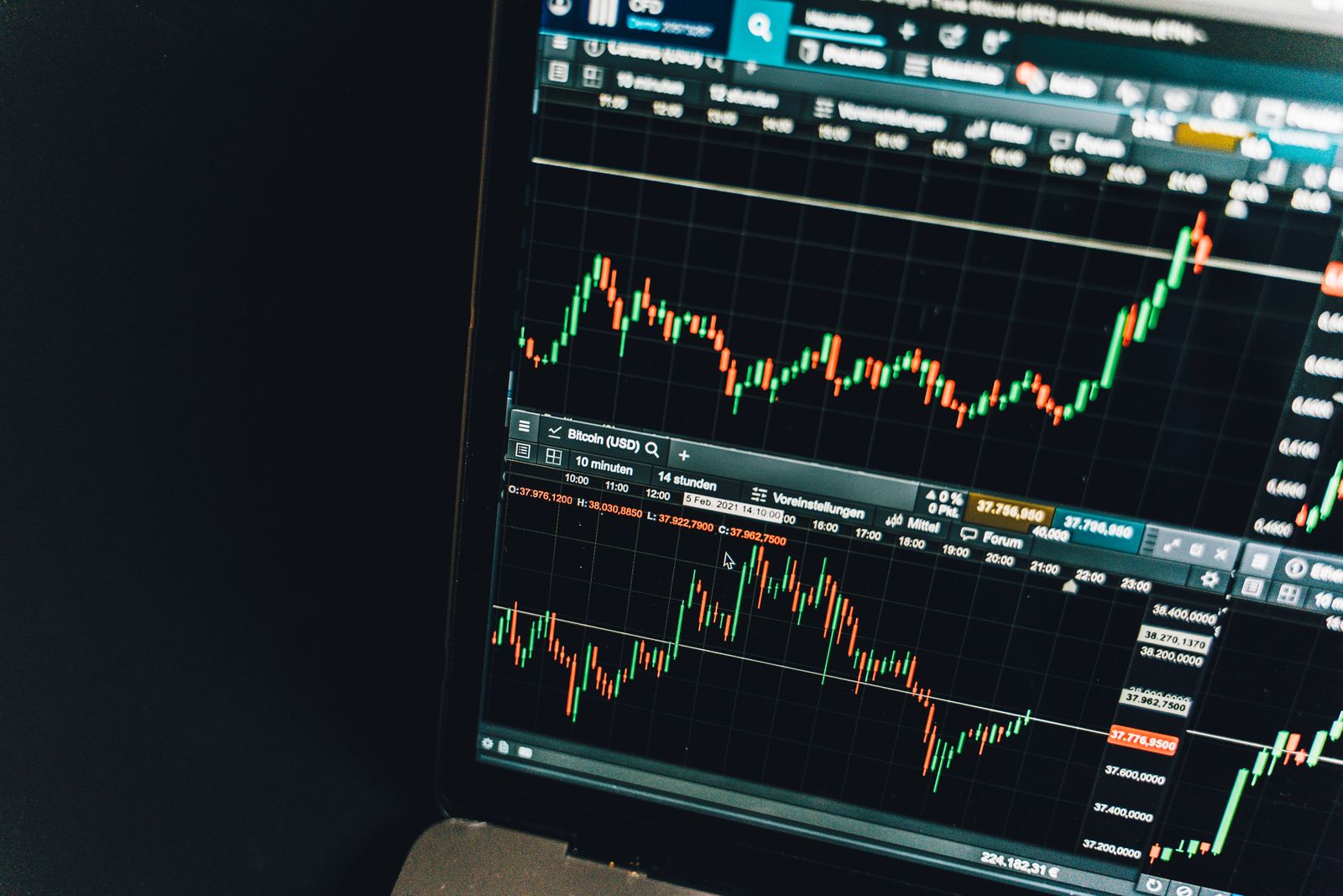 Data dashboard with charts and metrics displayed on a laptop screen.