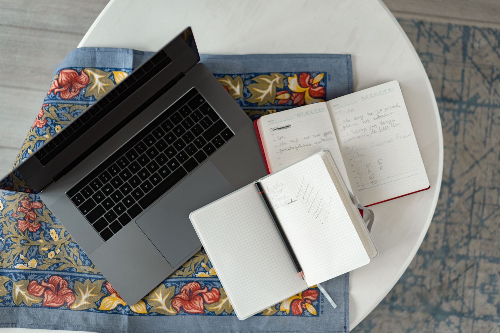 Nonprofit team working around a laptop in a bright collaborative space.