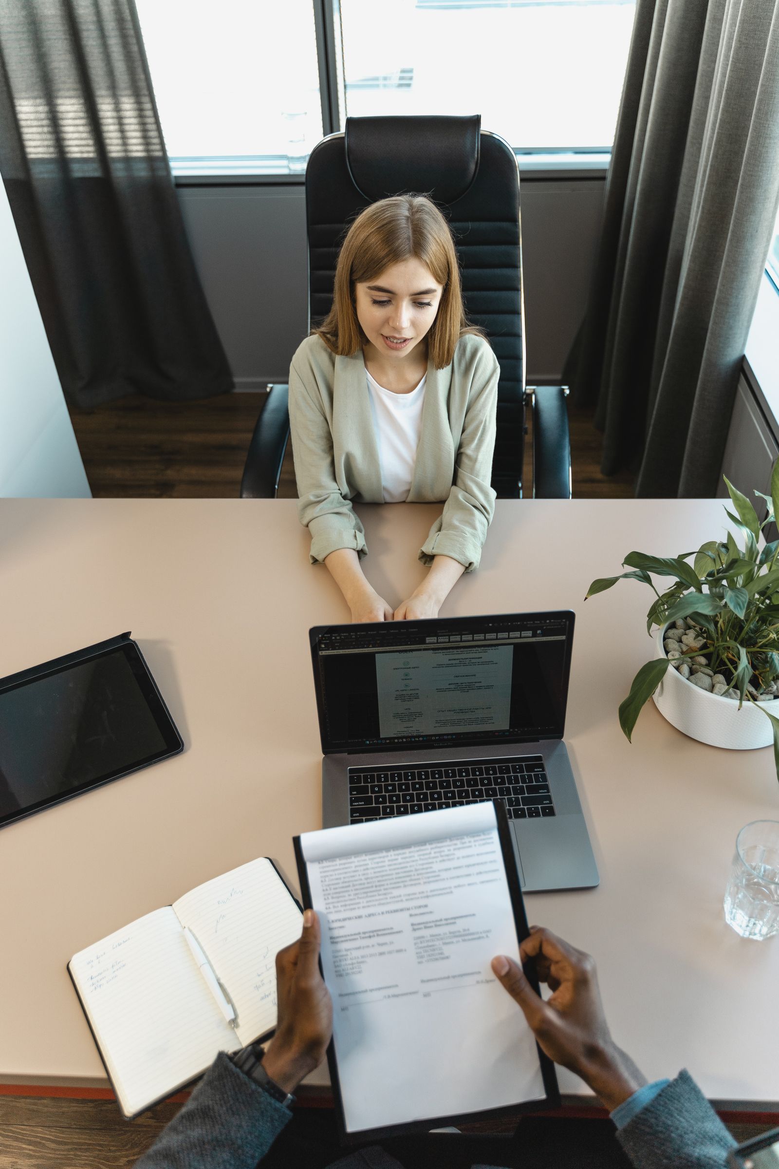 HR leader in a warm interview conversation across a desk.